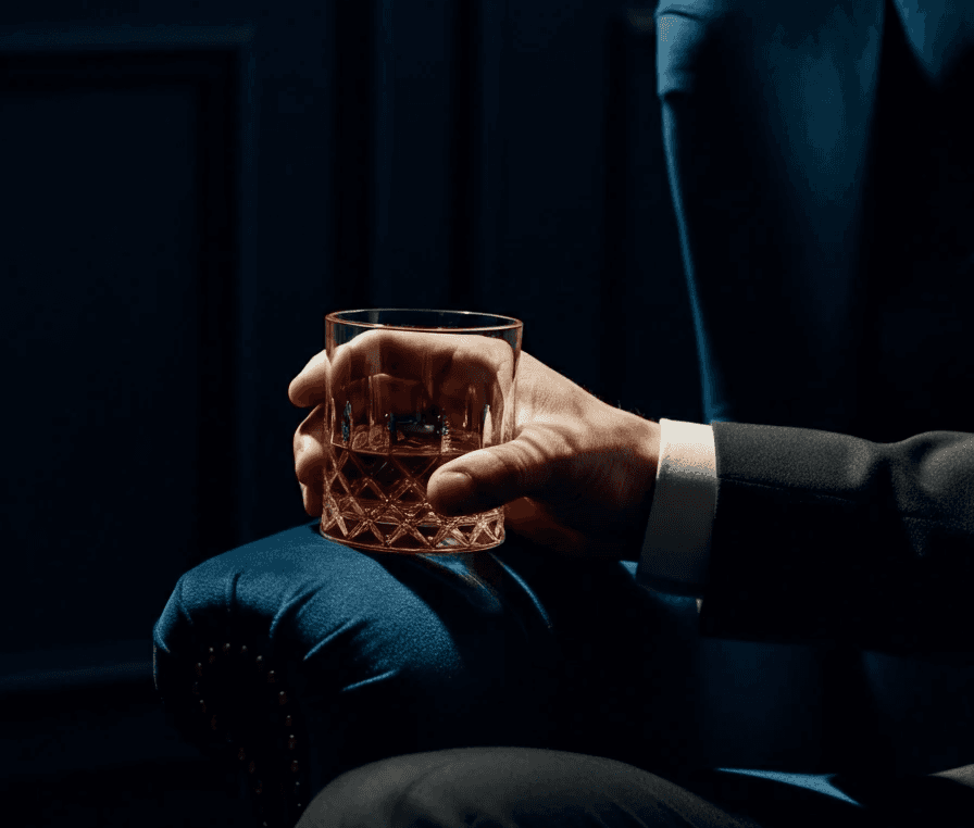 a man holding a cocktail